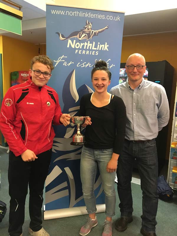 James Linklater from Northlink Ferries presenting Orkney captains Mia McAllister and Hamish Burgon with the West Mainland Chamber of Commerce cup