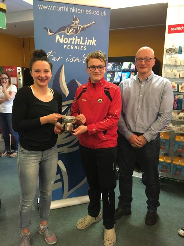 James Linklater from Northlink Ferries presenting Orkney captains Mia McAllister and Hamish Burgon with the Sugarbowl