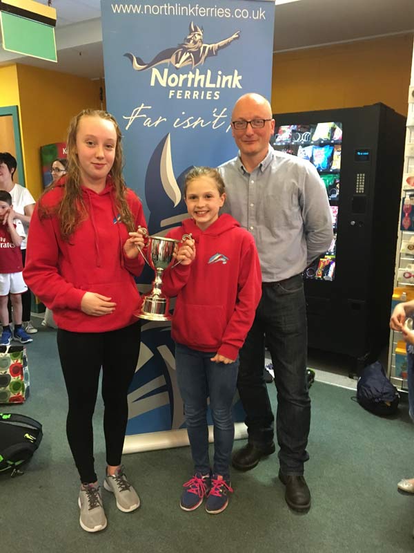 James Linklater from Northlink Ferries presenting Thurso captains Erin McDonald and Alex Mackay with the Northlink Ferries Trophy